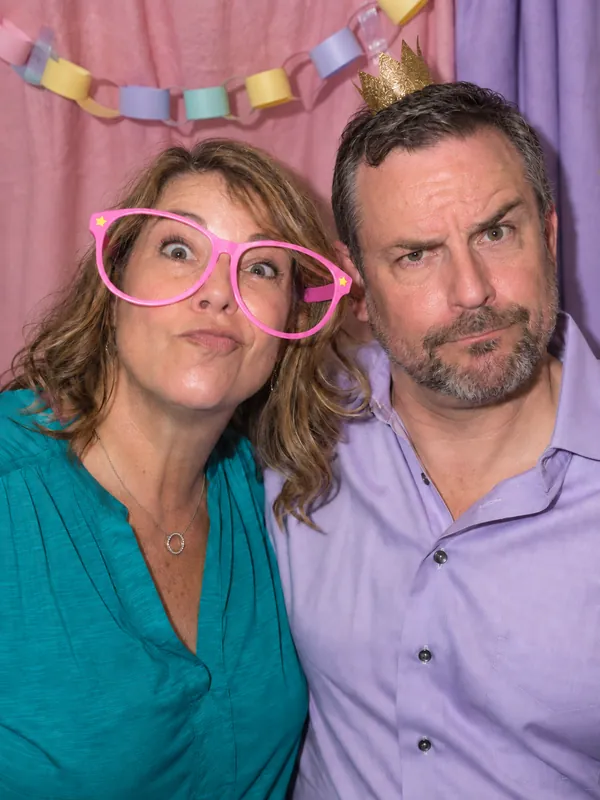 Couple in funny glasses at a Los Angeles party photobooth