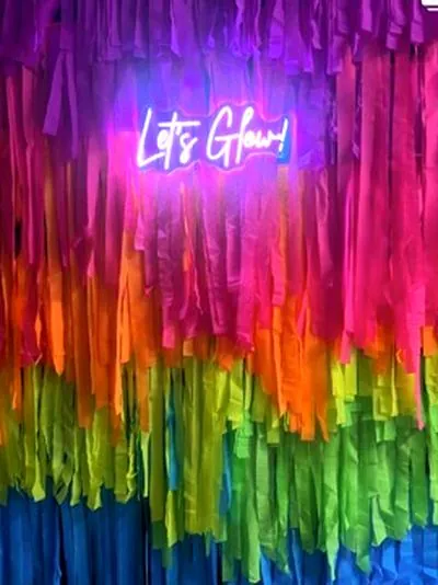 Rainbow fringe photobooth backdrop at an LA kids party