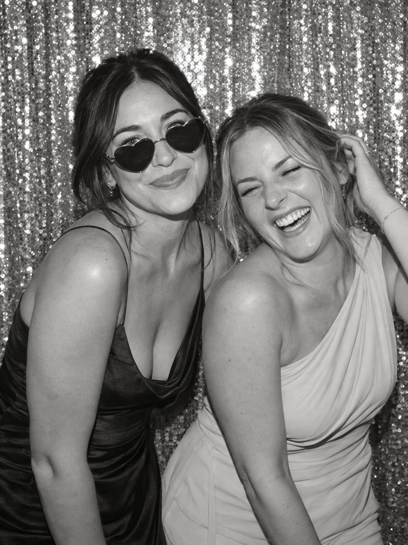 Los Angeles wedding photobooth - friends laughing on a silver sequin backdrop